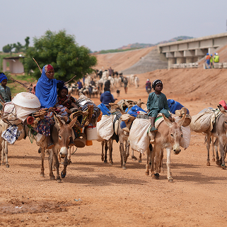 Local community transportation near Mota-Engil project site in Nigeria - mobile view.